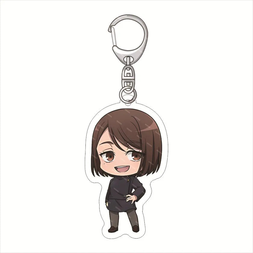 Porte-clés figurine chibi souriante, cheveux bruns, tenue noire