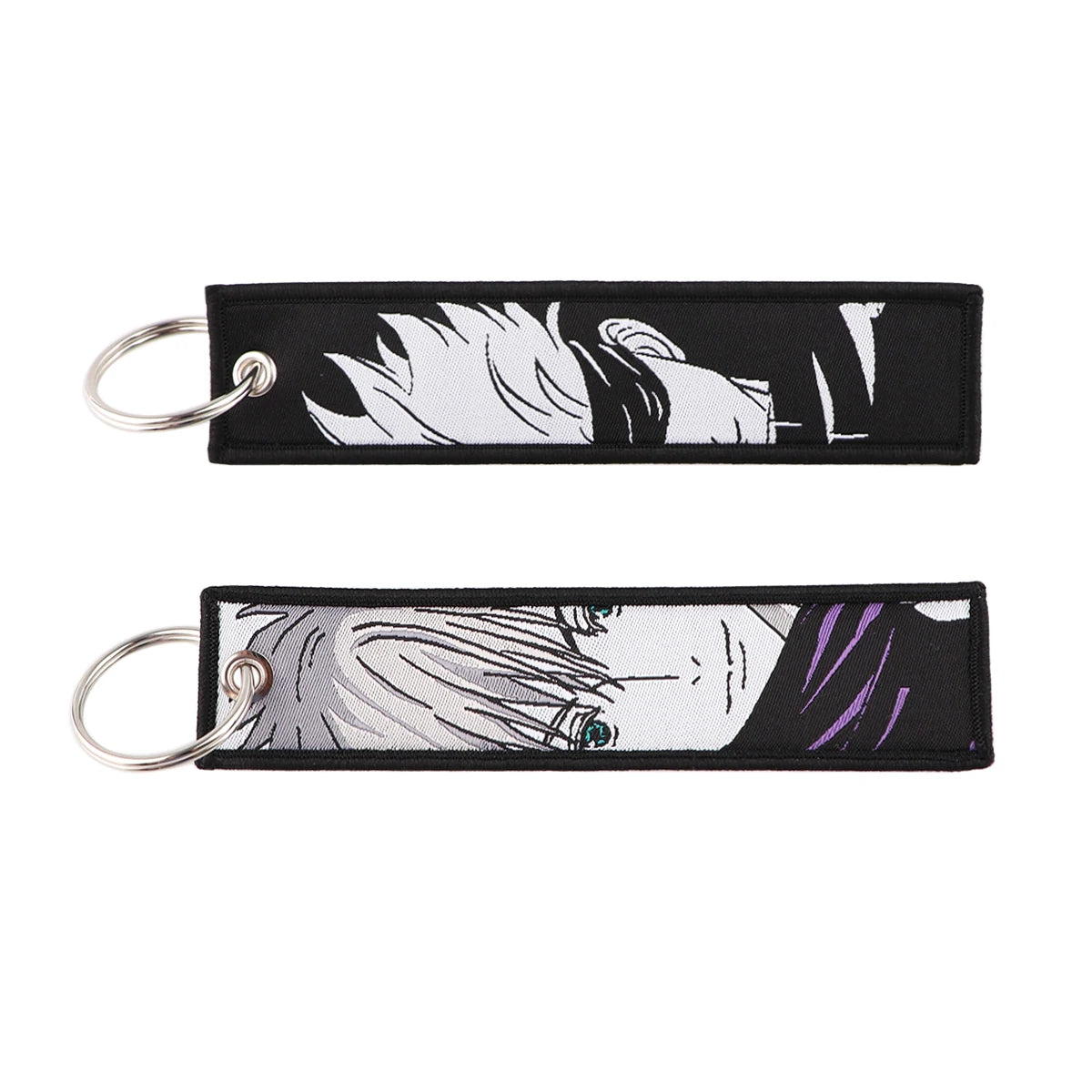Porte-clés Jujutsu Kaisen Gojo Noir et Blanc : en tissu noir et blanc avec illustration du visage de Gojo et anneaux.