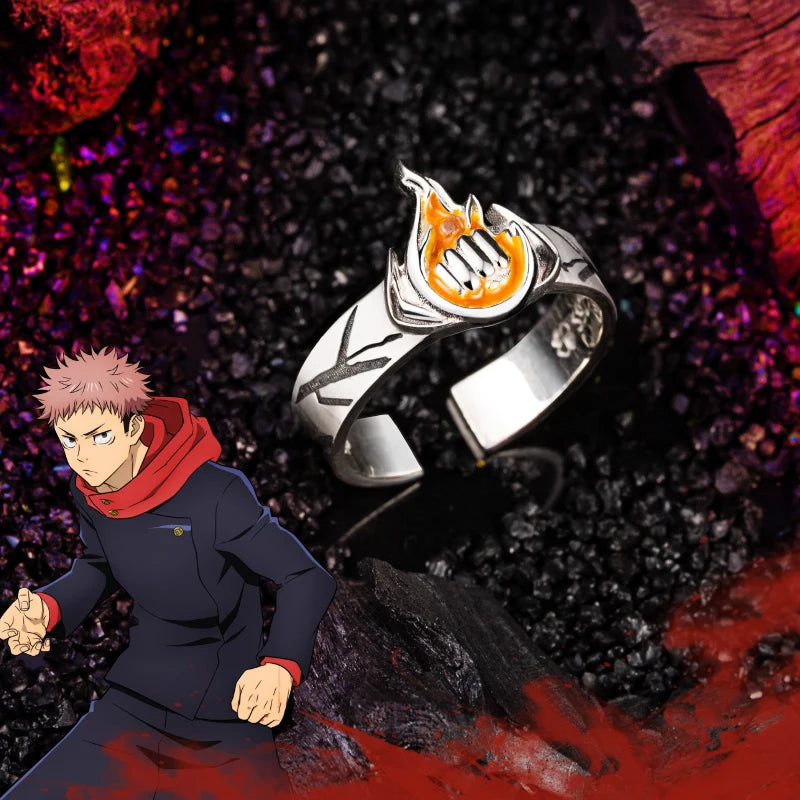 Bague argentée avec pierre orange sertie et motif de visage stylisé