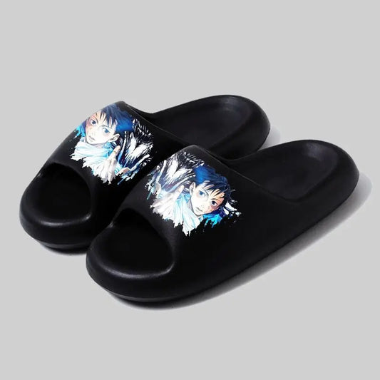 Claquettes noires avec imprimé personnage bleu sur le dessus