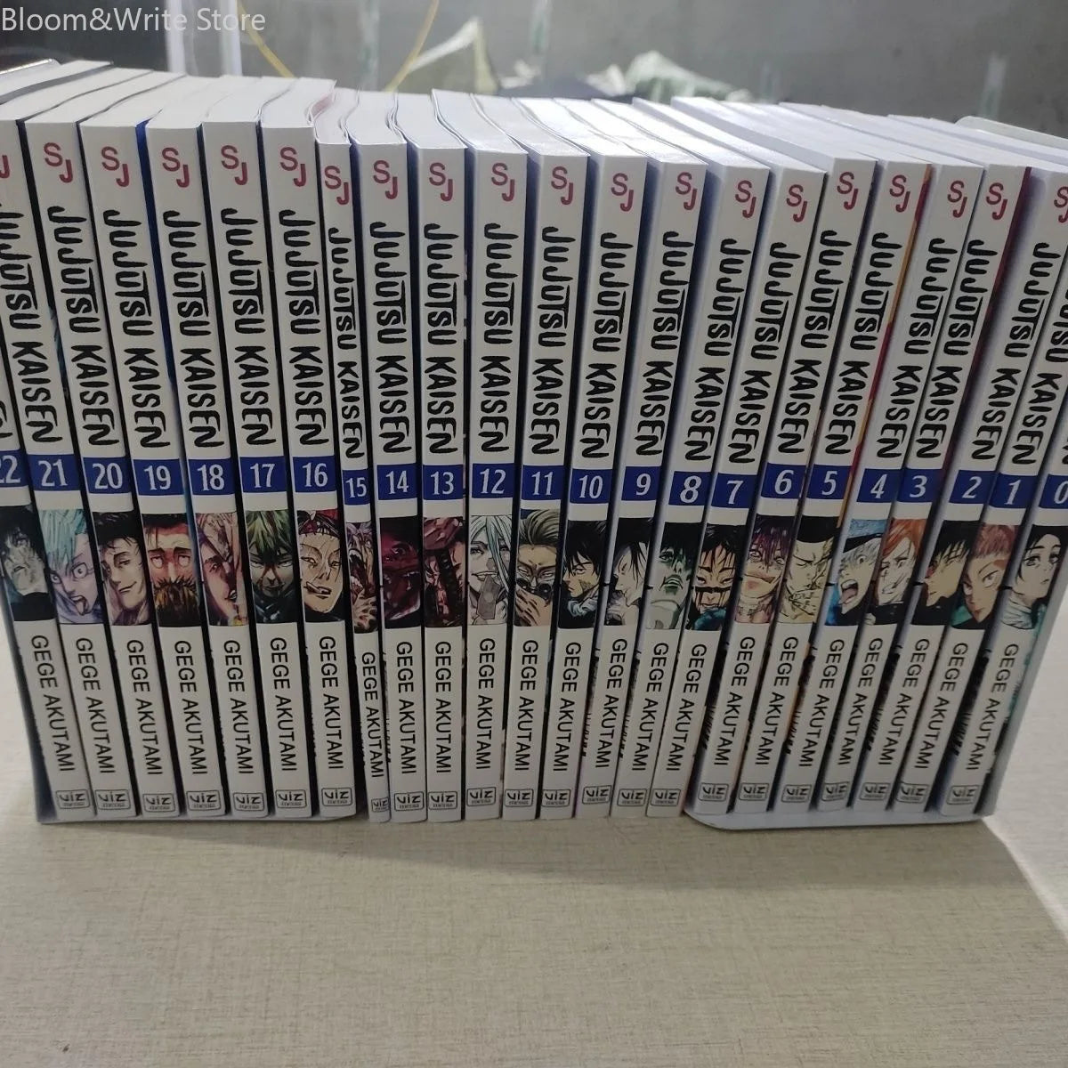 Jujutsu Kaisen manga spines lined up, with volume numbers printed along the side