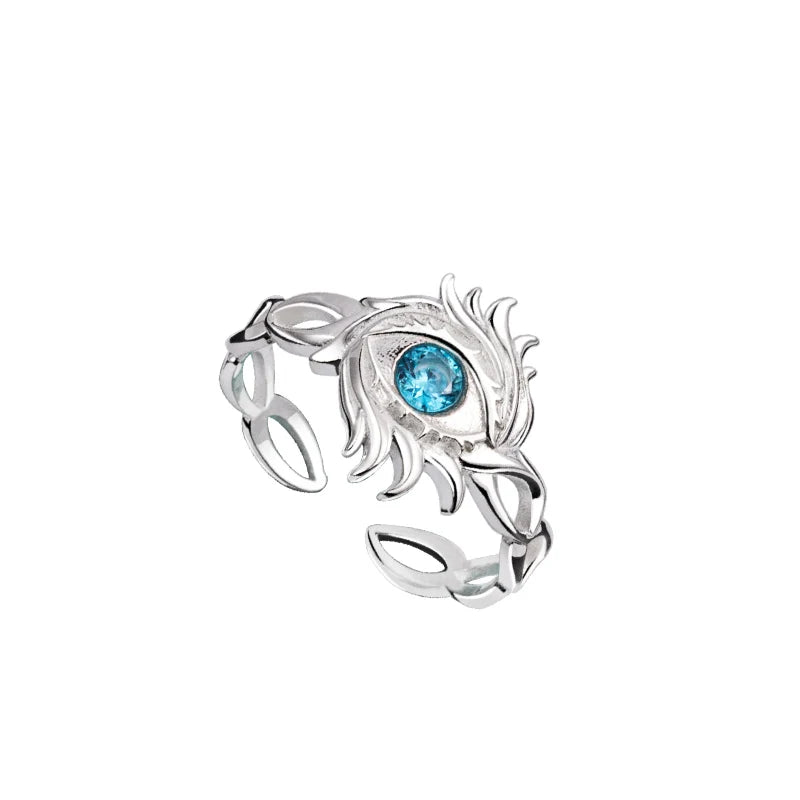 Bague argentée à motif sculpté, avec pierre bleue ovale