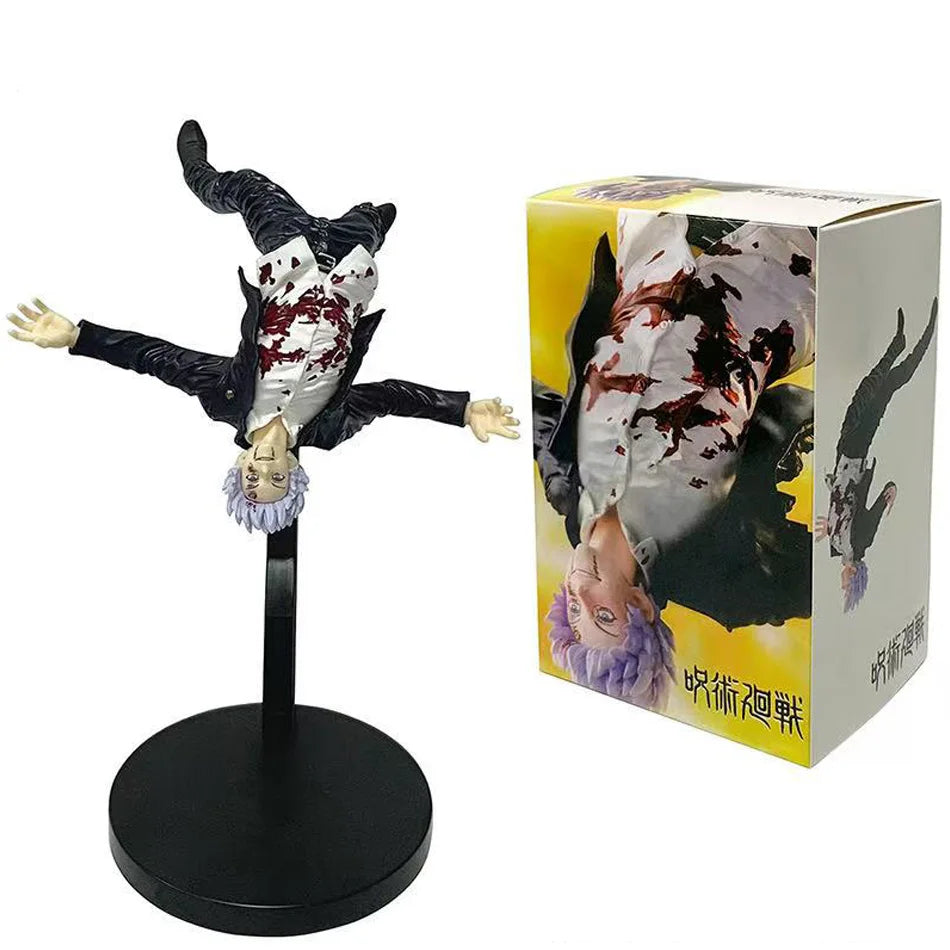 Figurine Gojo et boîte : bras écartés, cheveux noirs, visage blanc éclaboussé