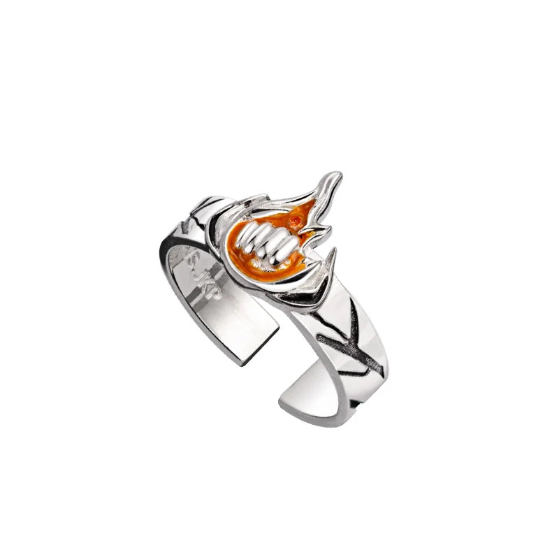 Bague argentée avec pierre orange sertie et motif de main stylisée
